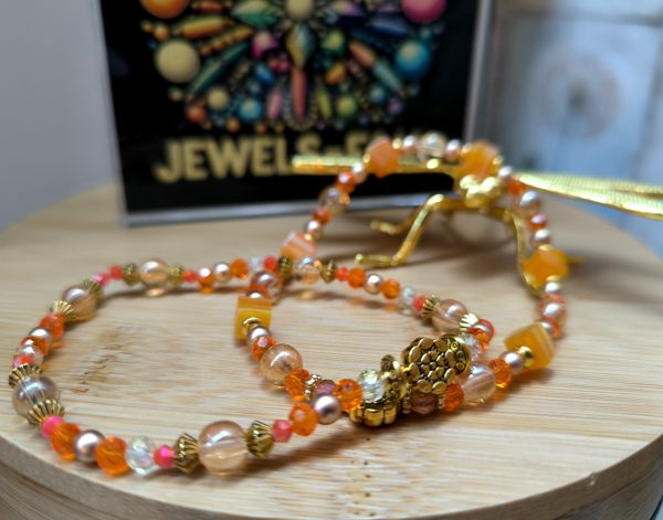 nieuw!! 2 armbanden oranje tinten